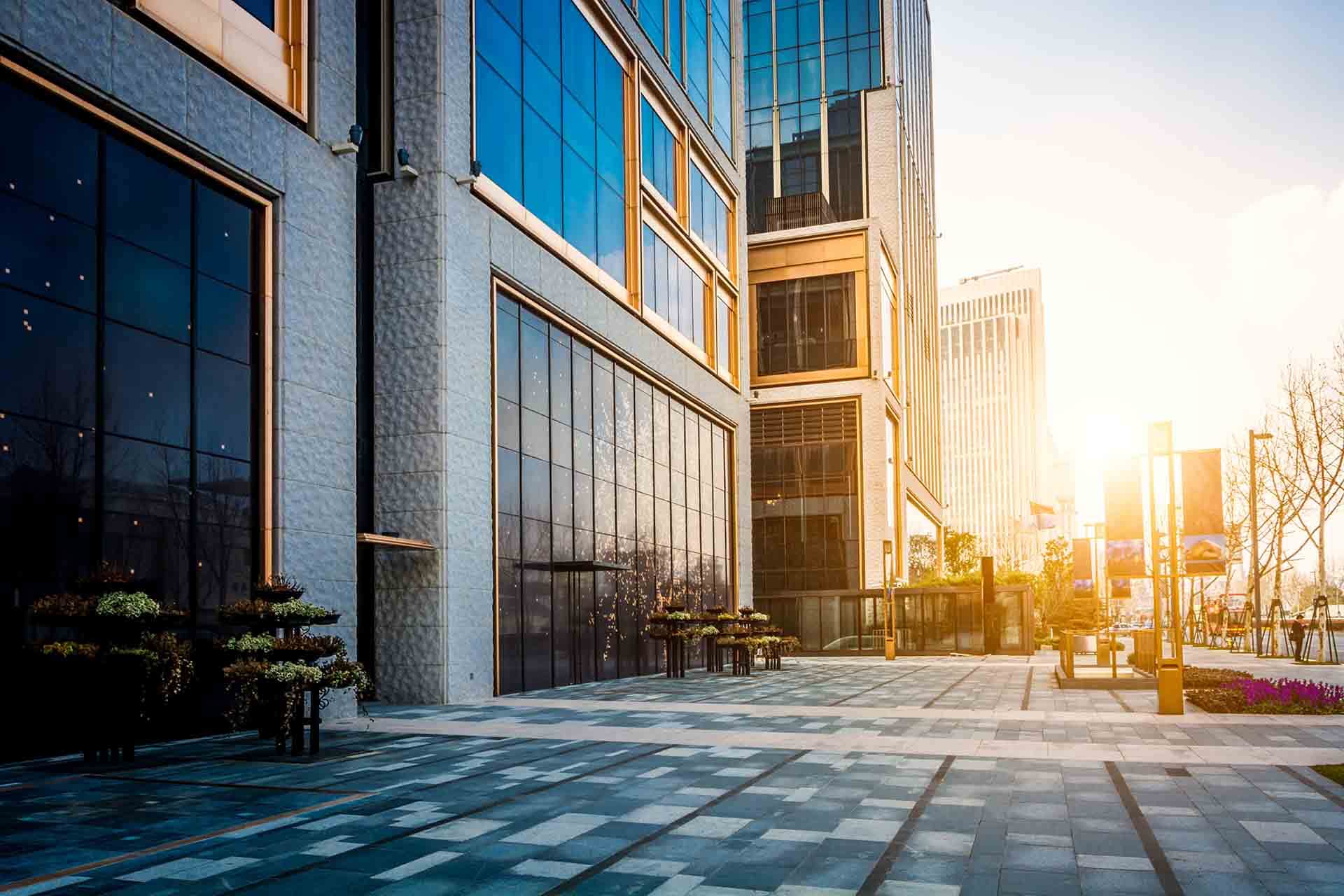 Commercial buildings on an urban plaza at sunset